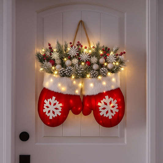 Red mitten Christmas wreath with lights, pine, red berries and snowflakes hanging on a white front door